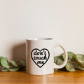 "Don't touch me" mug.